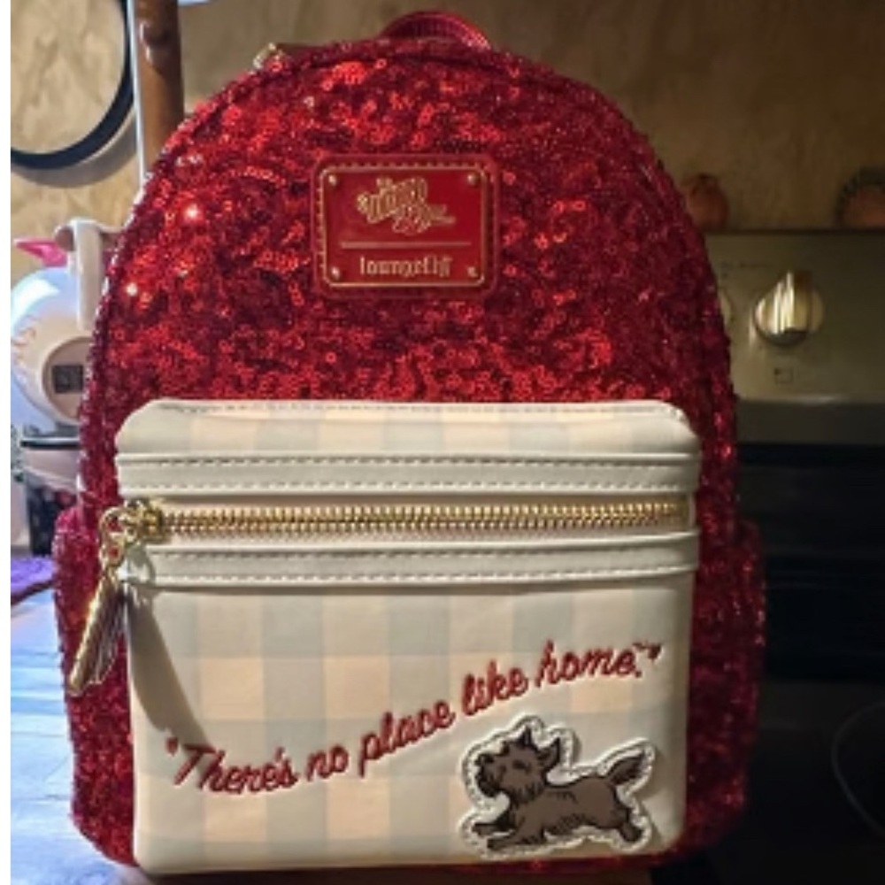 Loungefly red sequin wizard of oz, ruby red slippers on back. NWT . SOLD